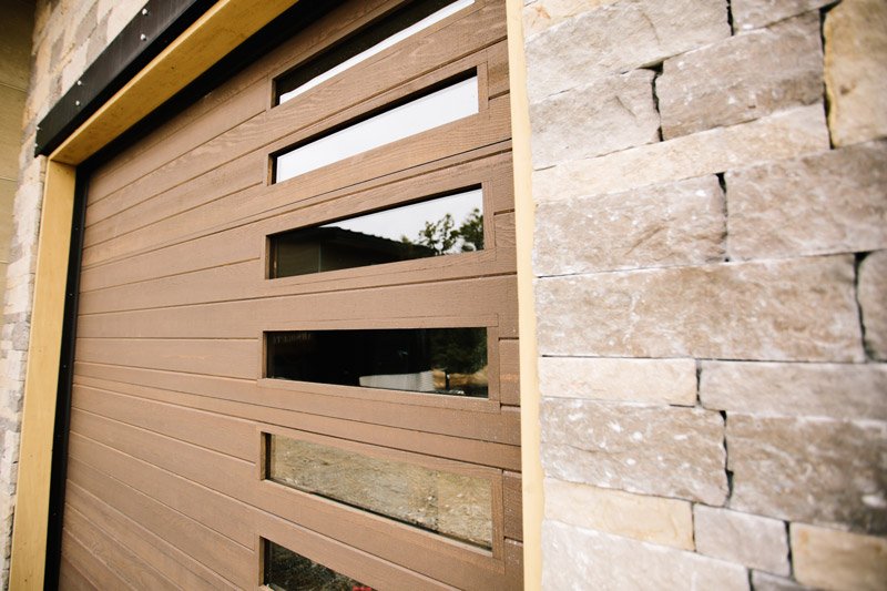 Custom wood garage door with vertical windows 