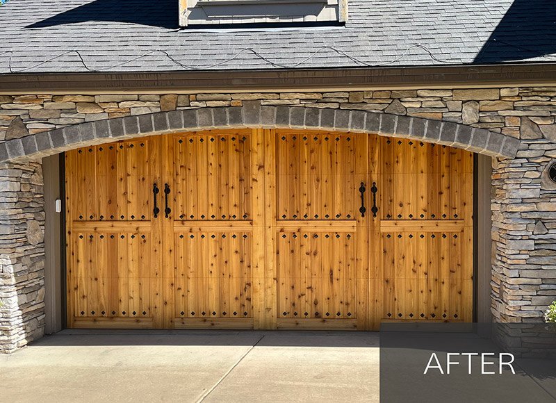 Custom barn wood garage door being sanded 