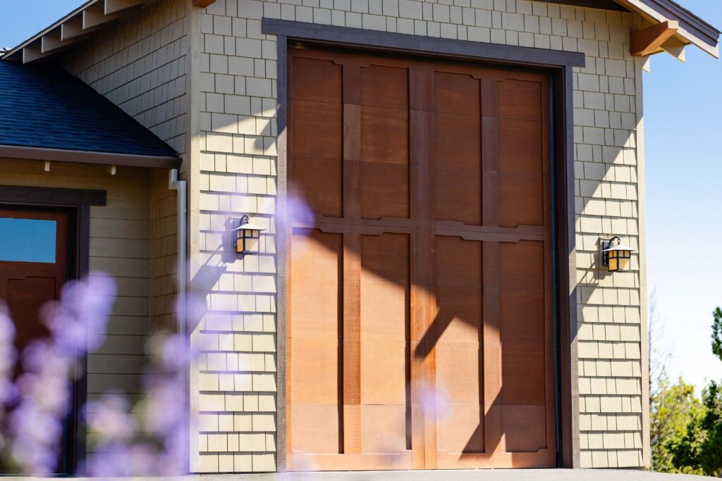 close up of cloud lift detailing on custom wood garage door