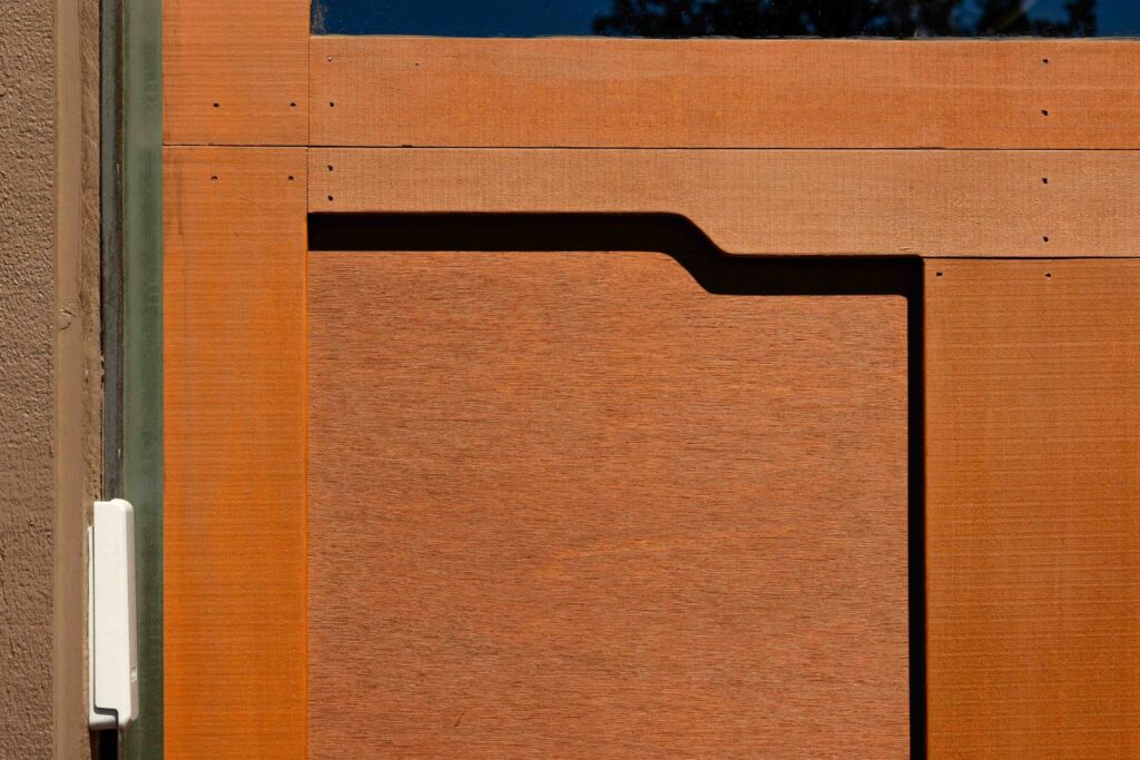 close up of cedar finish on custom wood garage door