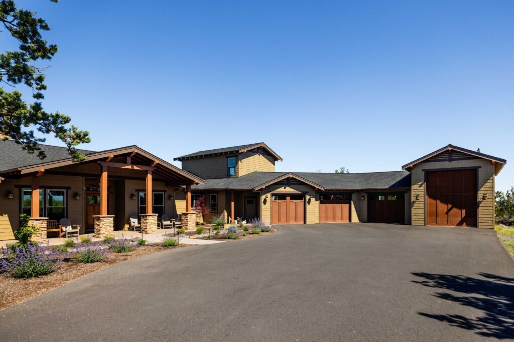 beautiful arts and crafts home with custom wood garage doors using Greene and Greene design