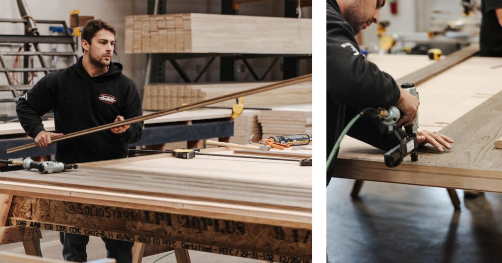 man laying down and nailing wood on custom garage door