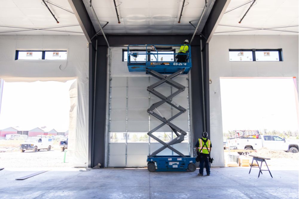 central oregon garage door team installing industrial garage door at a warehouse