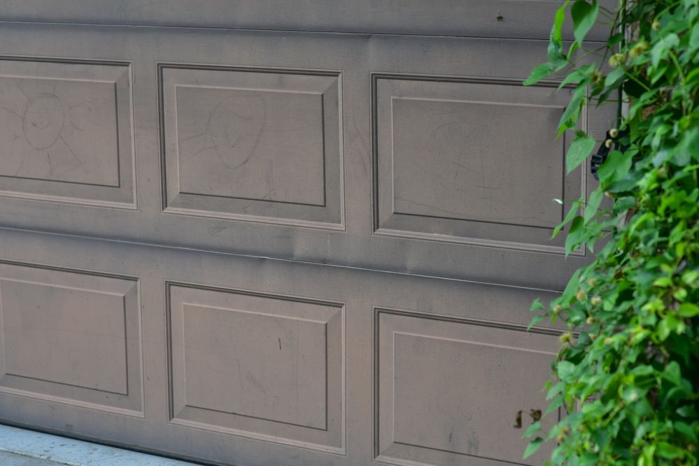 Garage Door Panel Replacement: Repair, Replace, or Get a New Door?